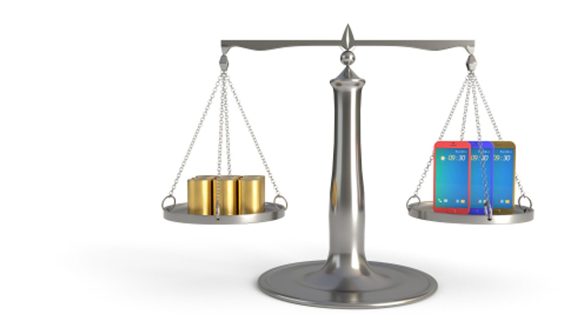 A set of scales with a sum of money on one side and mobile devices on the other