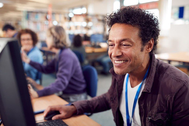 Mature student using computer